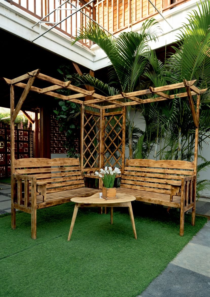 Wooden pergola seating in the resort garden